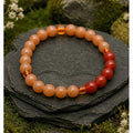 Red aventurine with 5 dark carnelian beads and orange glass spacers