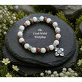 Howlite (8mm) with wooden beads & metal cubed spacers - Metal floral charm