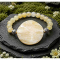 Honey jade (8mm) feature bead (40mm)